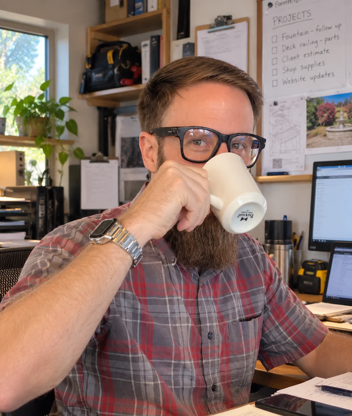 Evan taking a coffee break in his workshop office.