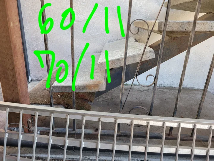 Side view of the damaged stair tread before replacement, with the original handwritten annotations.