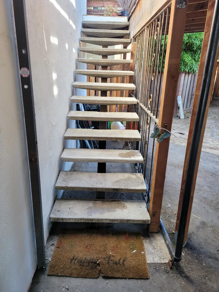 Front view up the exterior staircase after tread replacement.